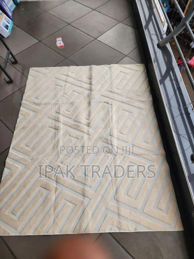 American Carpet 
5by8
Colours 
Cream, Beige and Grey