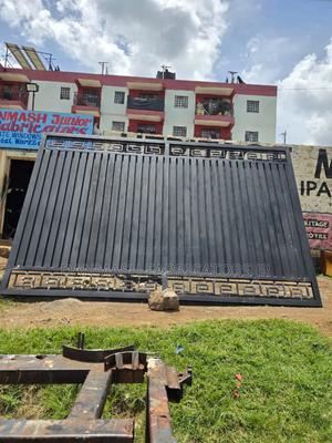 Modern Black Sliding Gate With Golden Detailing - thumbnail 2