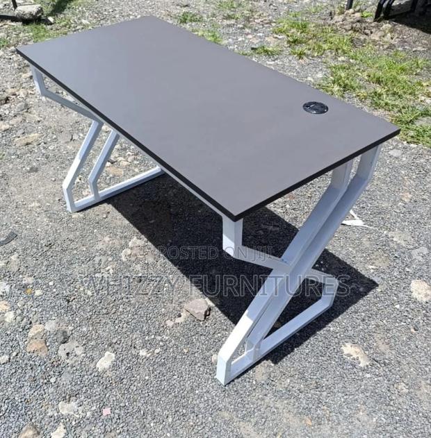 Modern Office Desk With a Grey Top and White Metal Legs