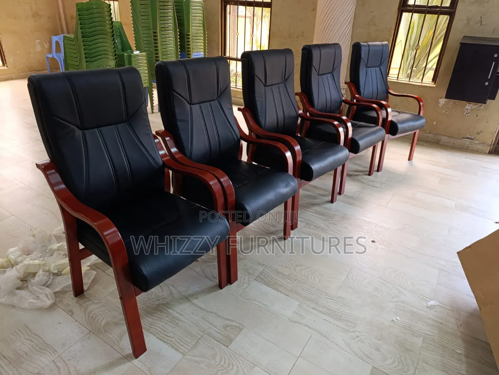 Executive Waiting Chair With a Black Leatherette Seat and Back