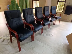 Executive Waiting Chair With a Black Leatherette Seat and Back