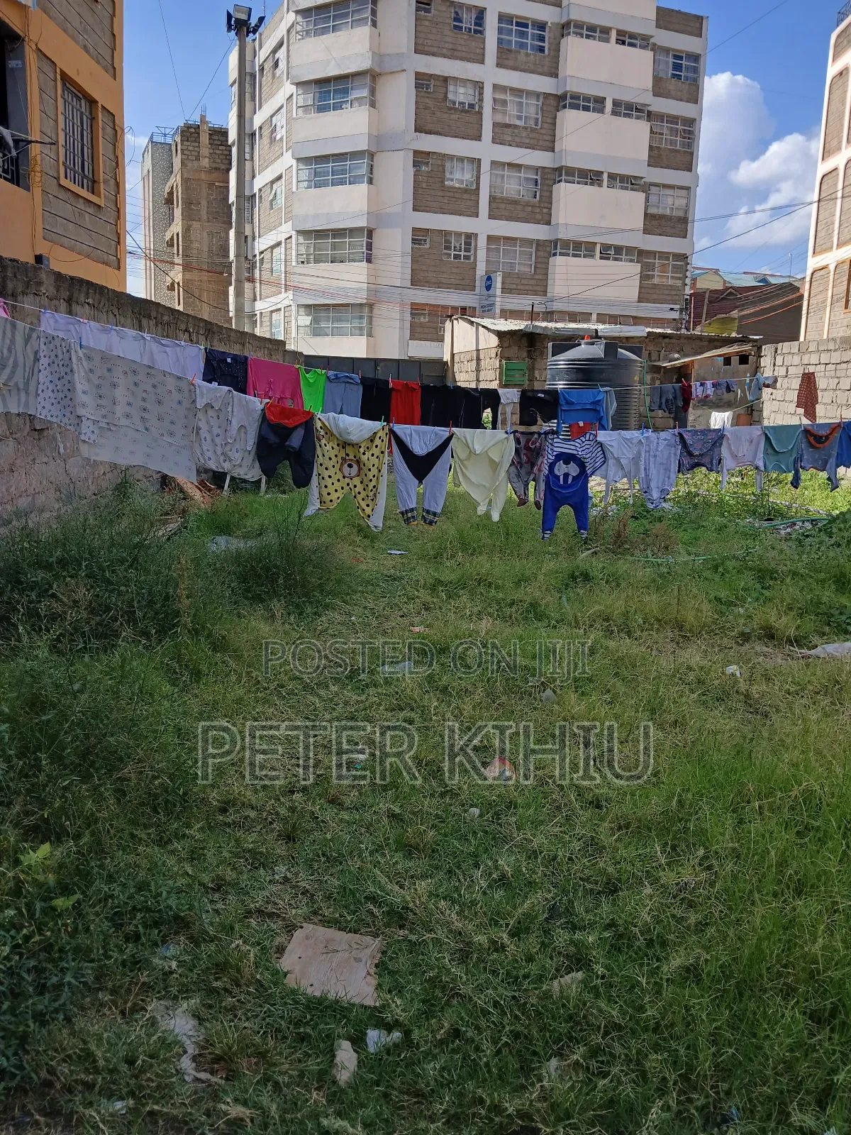 Tassia2 110ft by 33ft Plot With Wall Fence,Power,Water Tank and 2shops