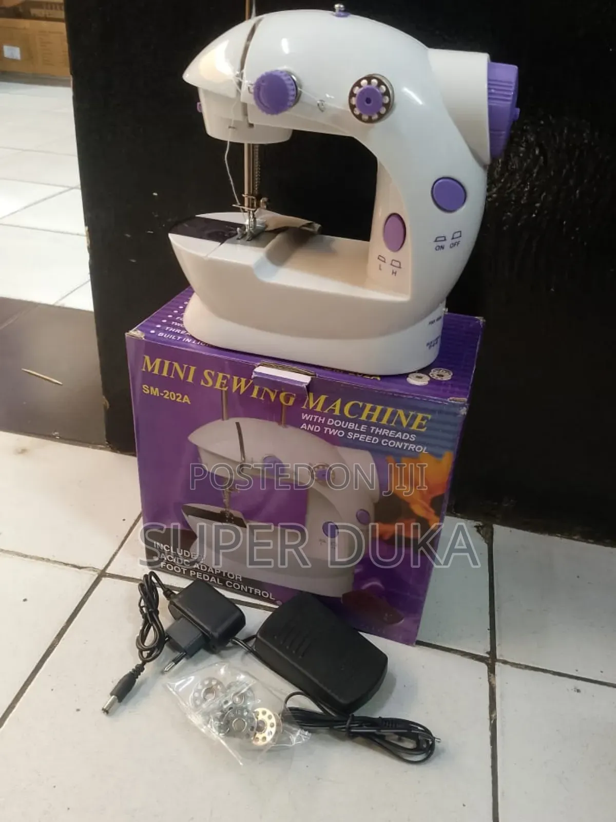 Portable Mini Sewing Machine, Model Sm-202a.