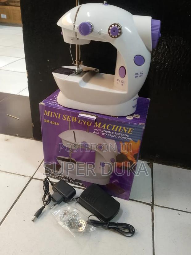Portable Mini Sewing Machine, Model Sm-202a.