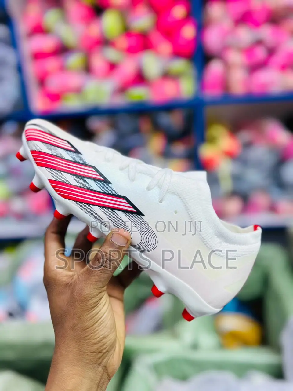 Red and White Adidas Football Boots