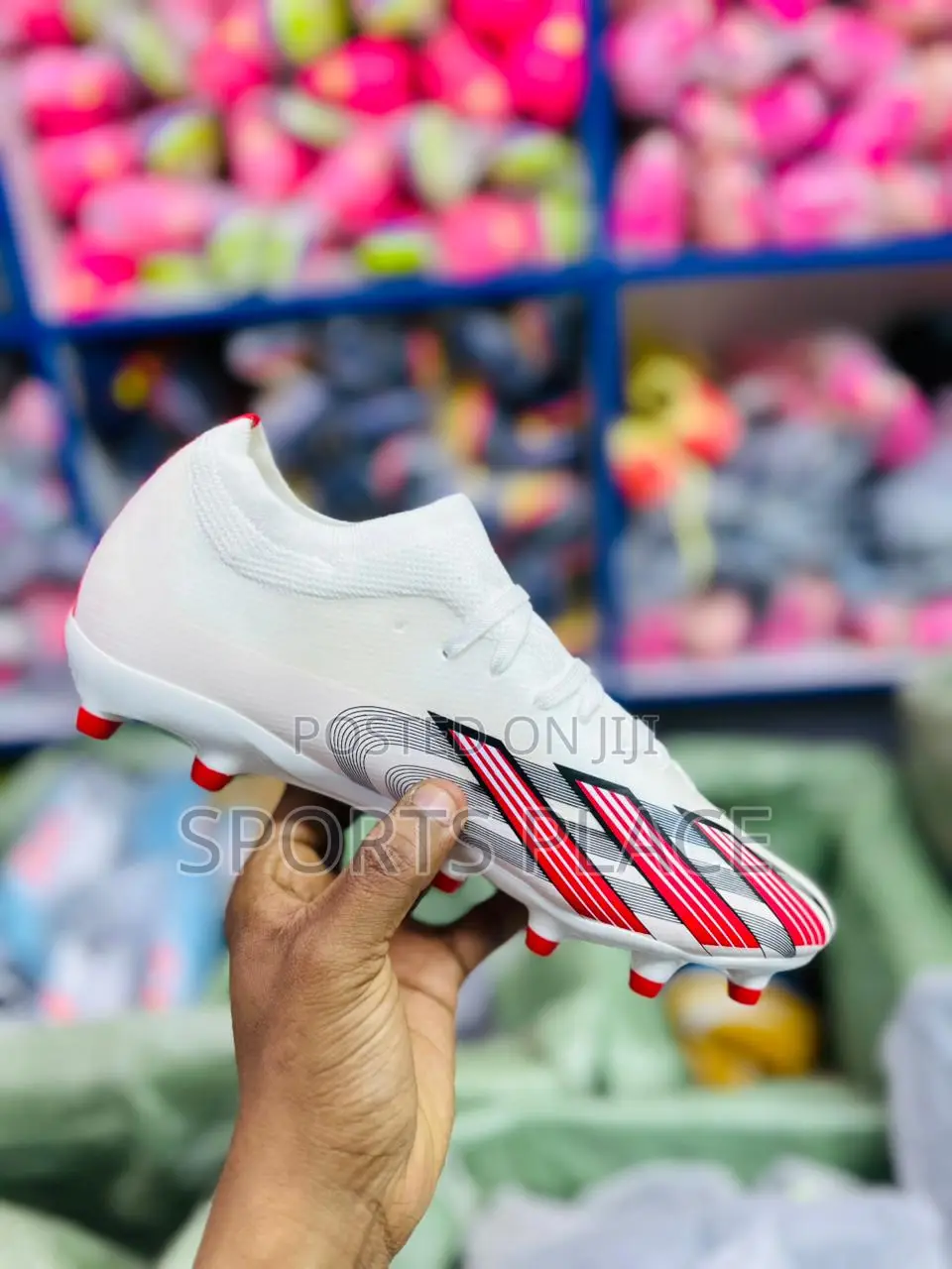 Red and White Adidas Football Boots