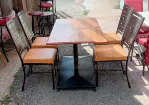 Mahogany Restaurant Set With Laser-Cut Design Chairs.