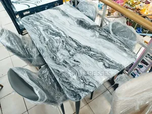 Imported Dining Set With Marble Top Table and 4 Leather Chairs.