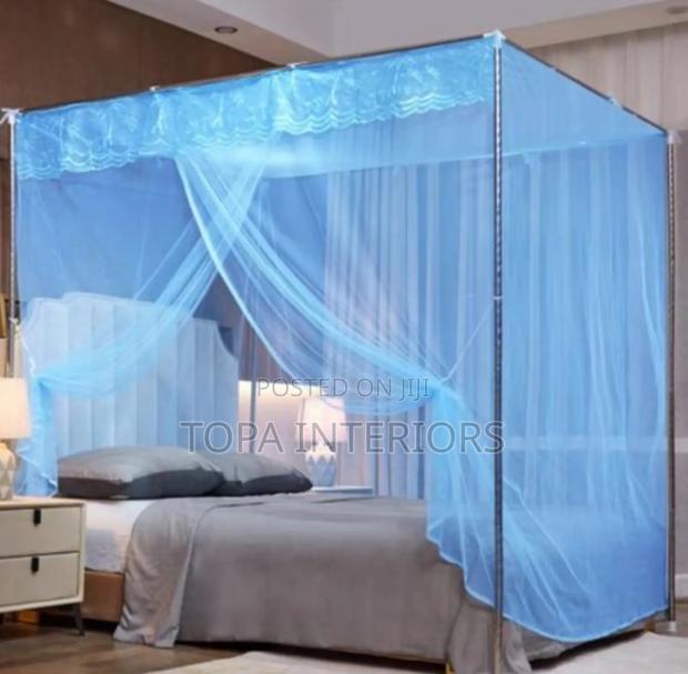 Blue Mosquito Nets With Four Metallic Tube Stands