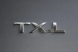 TXL Chrome Silver Badge Emblem