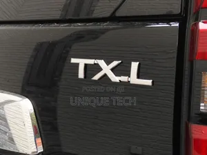 Silver TXL Chrome Emblem Logo