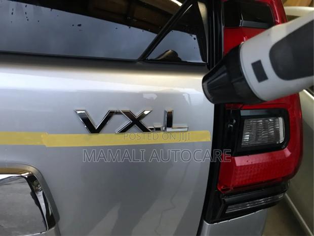 Silver Chrome VXL Car Emblem Logo - main view