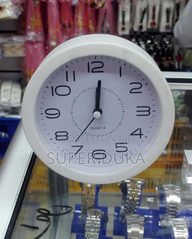 Alarm Clock. White, Round, Analog Quartz Alarm Clock.