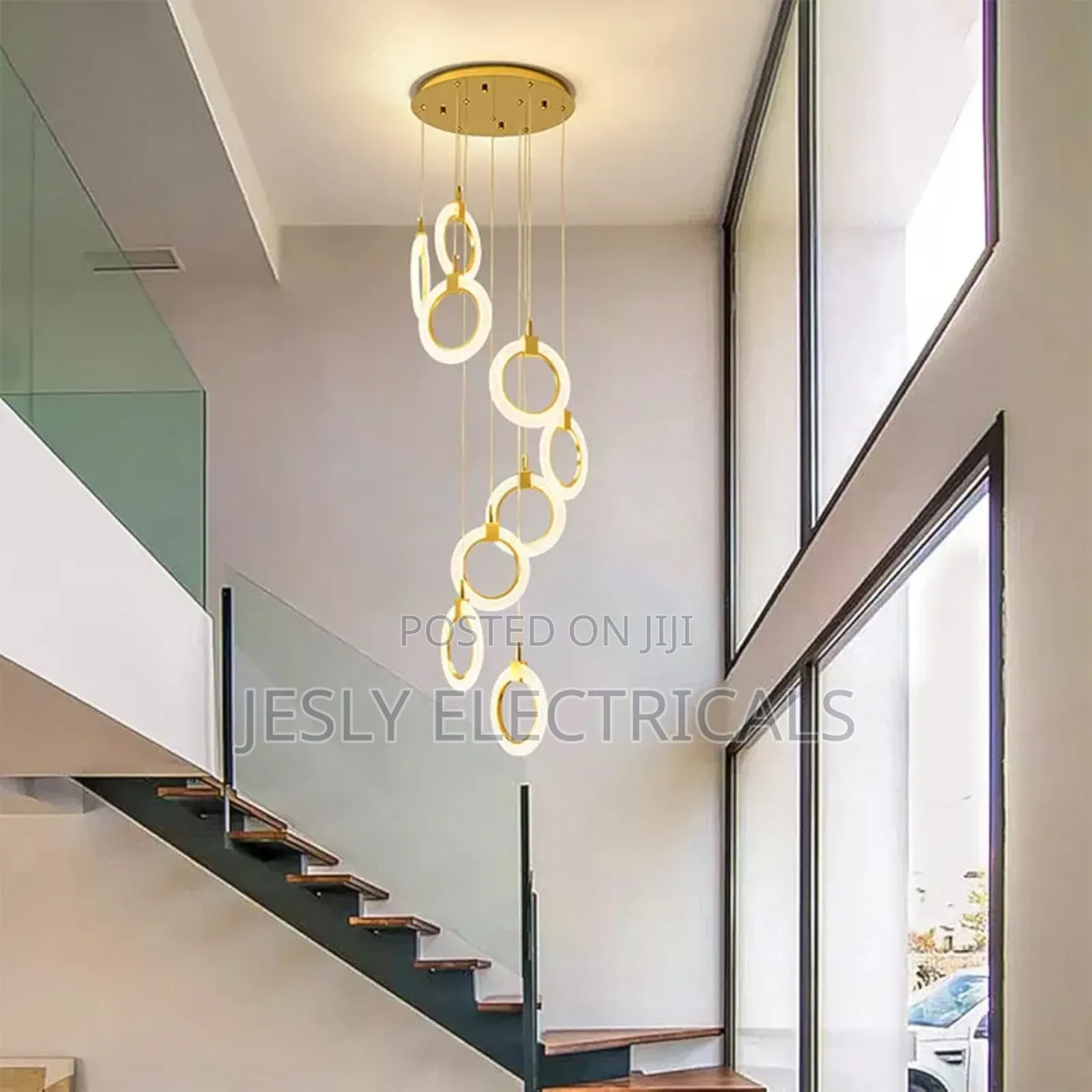 Modern Led Chandelier With a Gold Finish and Circular Rings.
