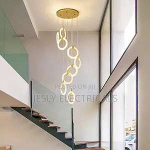 Modern Led Chandelier With a Gold Finish and Circular Rings.