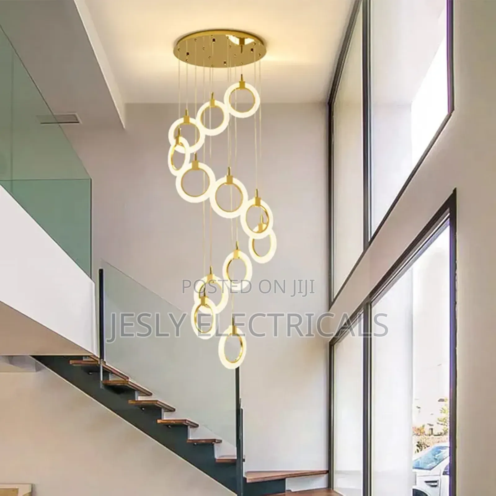 Modern Led Chandelier With a Gold Finish and Circular Rings.