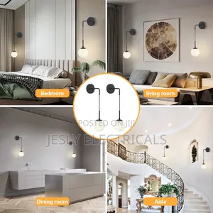 Matte Black Wall Sconce With a Frosted White Glass Globe