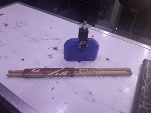 Cowbell and a Pair of Drumsticks
