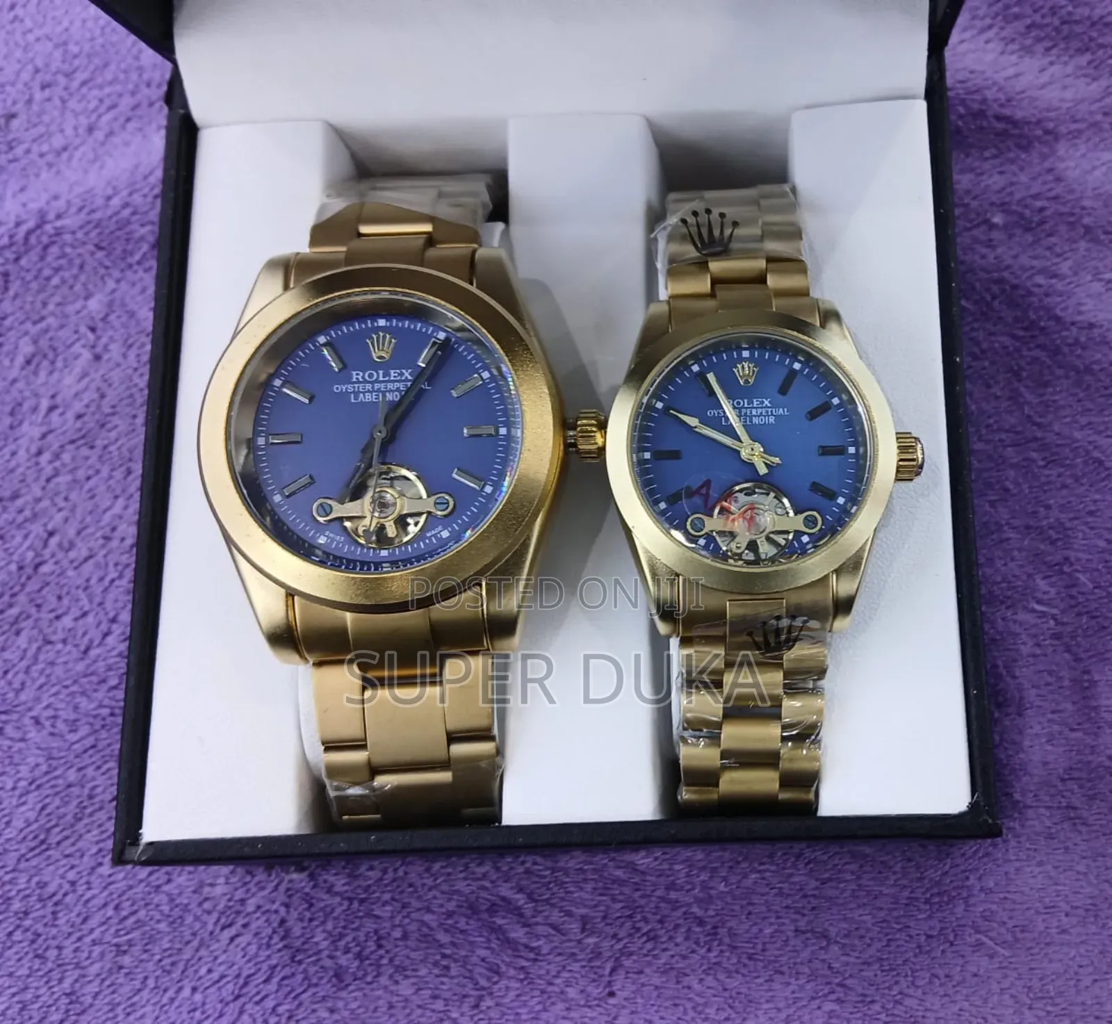 Wrist Watch. Pair of Gold-Toned Watches With Blue Dials.
