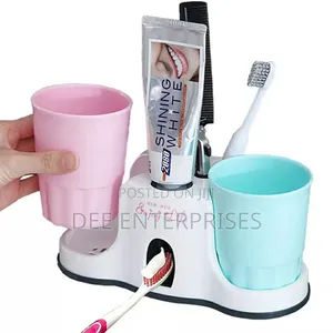 Toothbrush Holder With Toothpaste Dispenser.