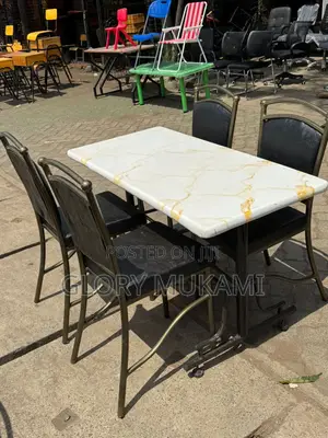 White Marble Table And Restaurant Chairs