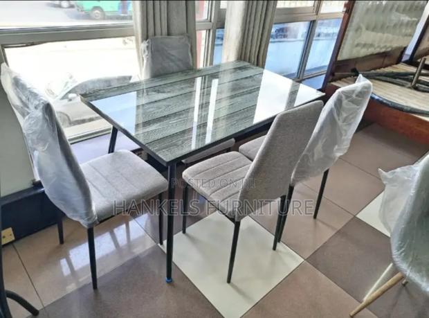 Elegant Glass Top Dining Table
