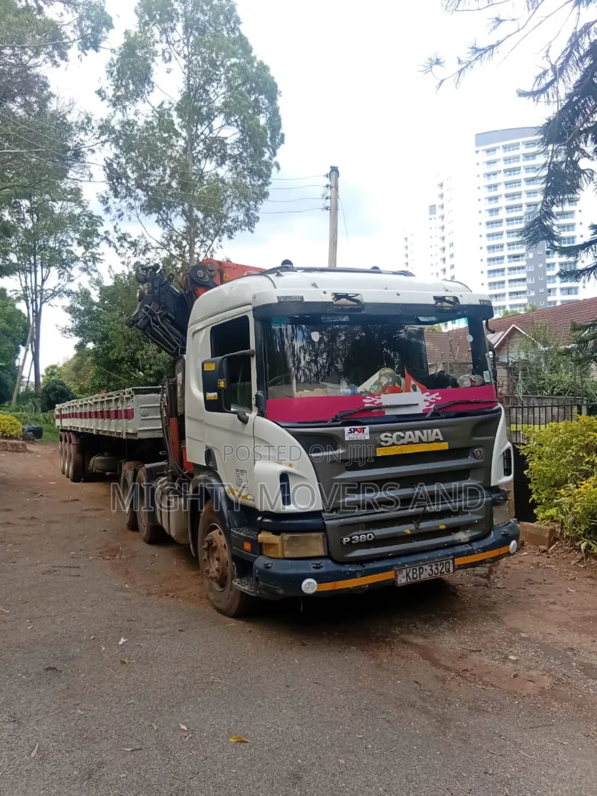 Flatbed Trailer With Crane Available for Transport Services