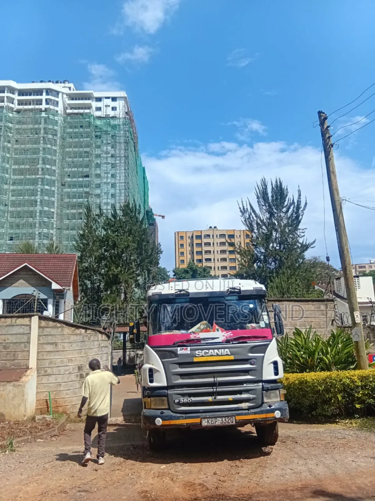 Flatbed Trailer With Crane Available for Transport Services