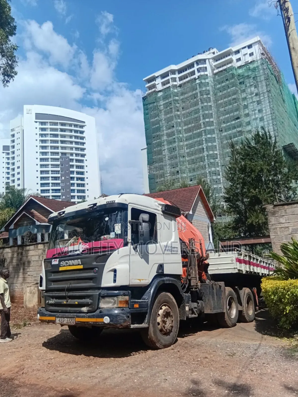 Flatbed Trailer With Crane Available for Transport Services