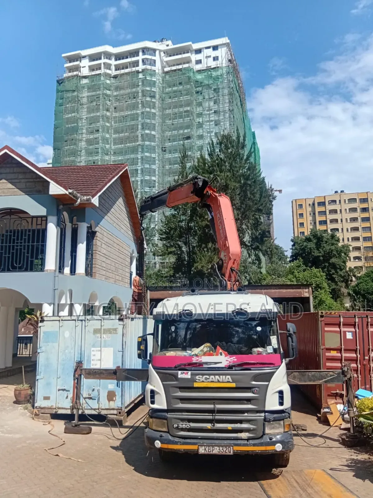 Flatbed Trailer With Crane Available for Transport Services