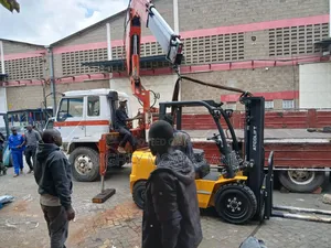 Flatbed Trailer With Crane Are at Hand for Transportation