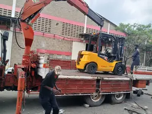 Flatbed Trailer With Crane Are at Hand for Transportation