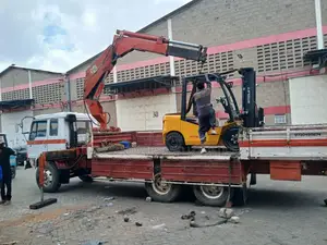 Flatbed Trailer With Crane Are Ready for Hoisting and Transportation