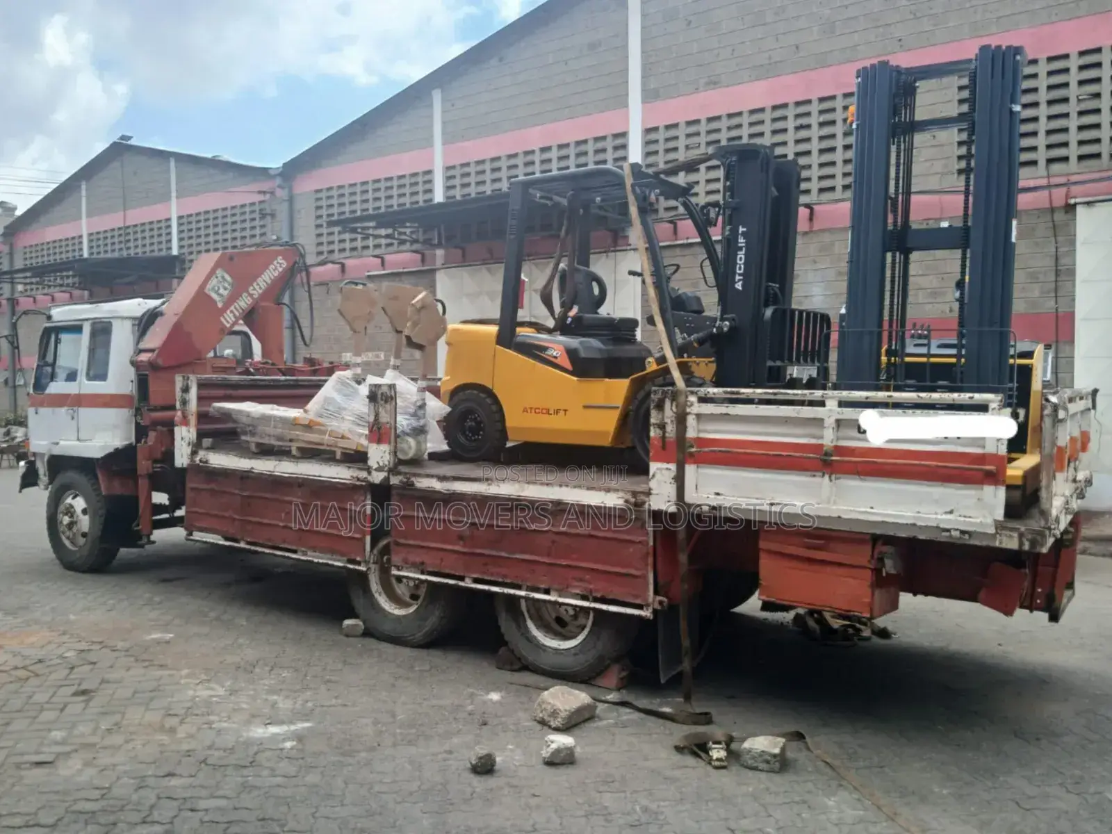 Trailer With Crane Ready for Transportation and Hoisting