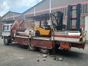 Trailer With Crane Ready for Transportation and Hoisting