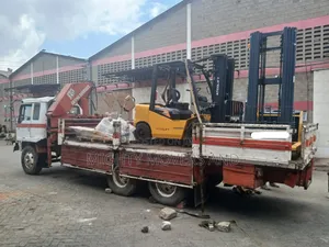 Trailer With Crane Ready for Transportation and Hoisting