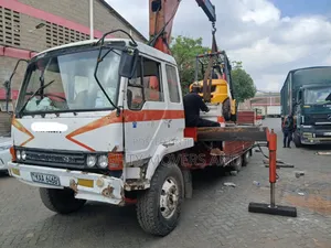 Flatbed Trailer With Crane Are at Hand Across Border Transportation
