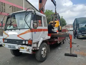Flatbed Trailer With Crane Are at Hand Across Border Transportation