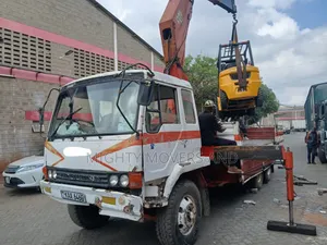 Flatbed Trailer With Crane Are at Hand Across Border Transportation