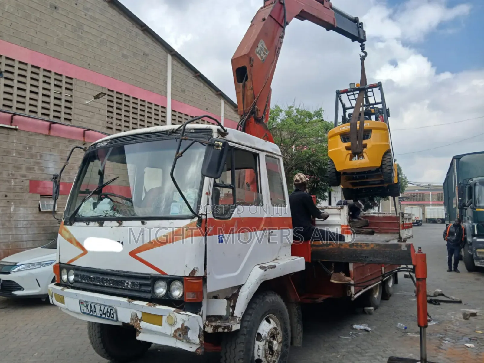 Flatbed Trailer With Crane Are at Hand Across Border Transportation