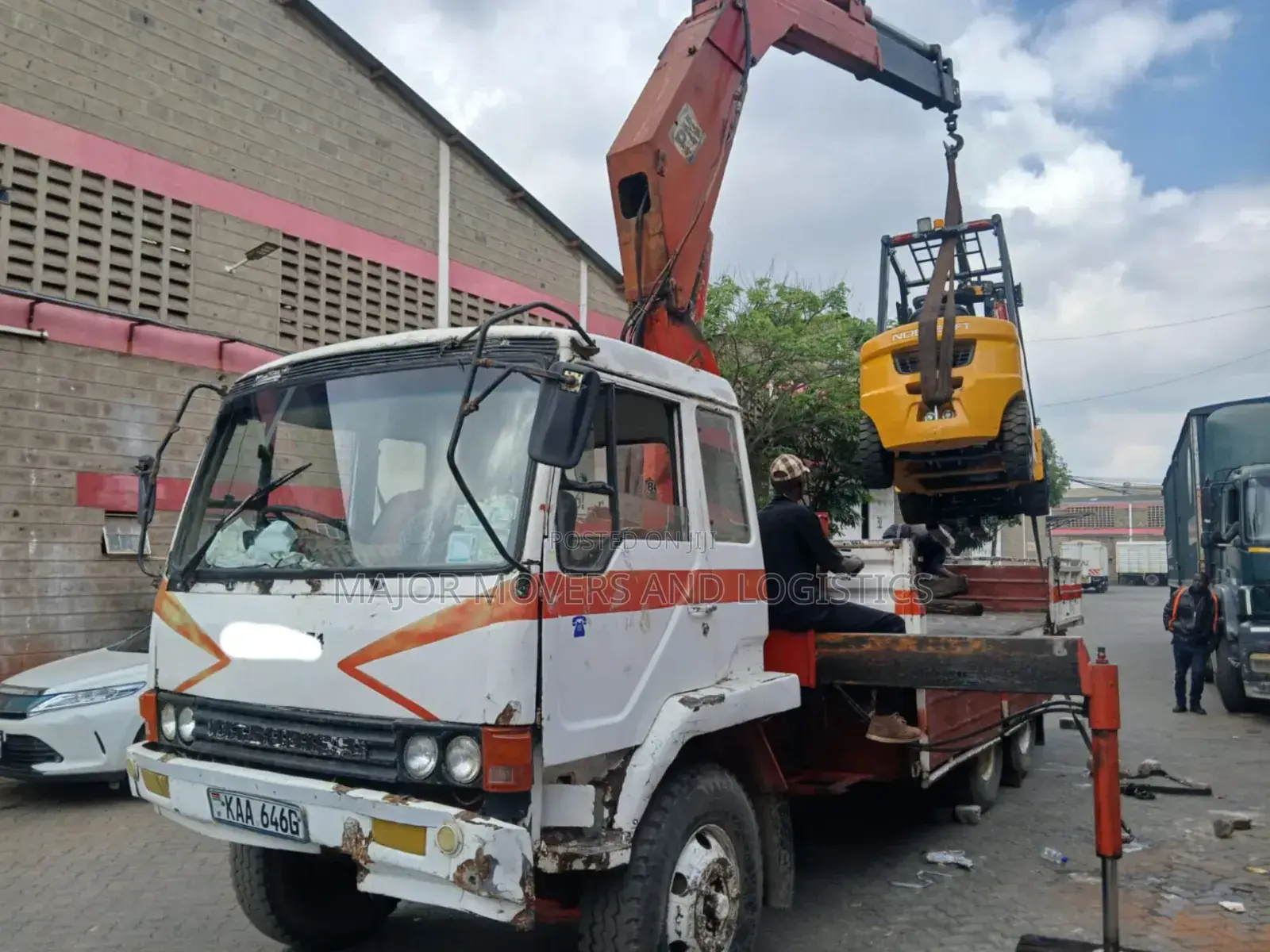 Flatbed Trailer With Crane Are at Hand Across Border Transportation