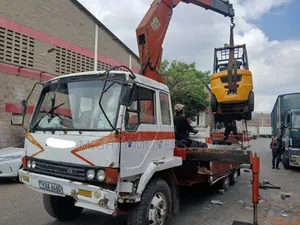 Flatbed Trailer With Crane Are at Hand Across Border Transportation
