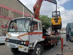 Flatbed Trailer With Crane Are at Hand Across Border Transportation