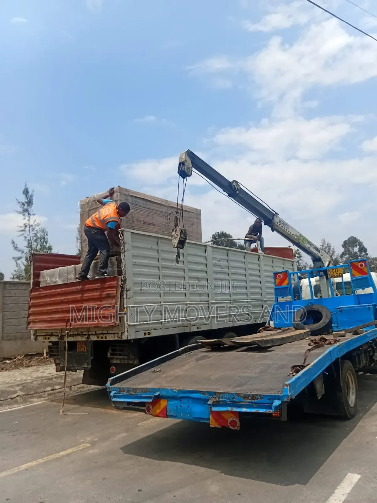 Flatbed Trailer With Crane Are at Hand for Cross Country Delivery