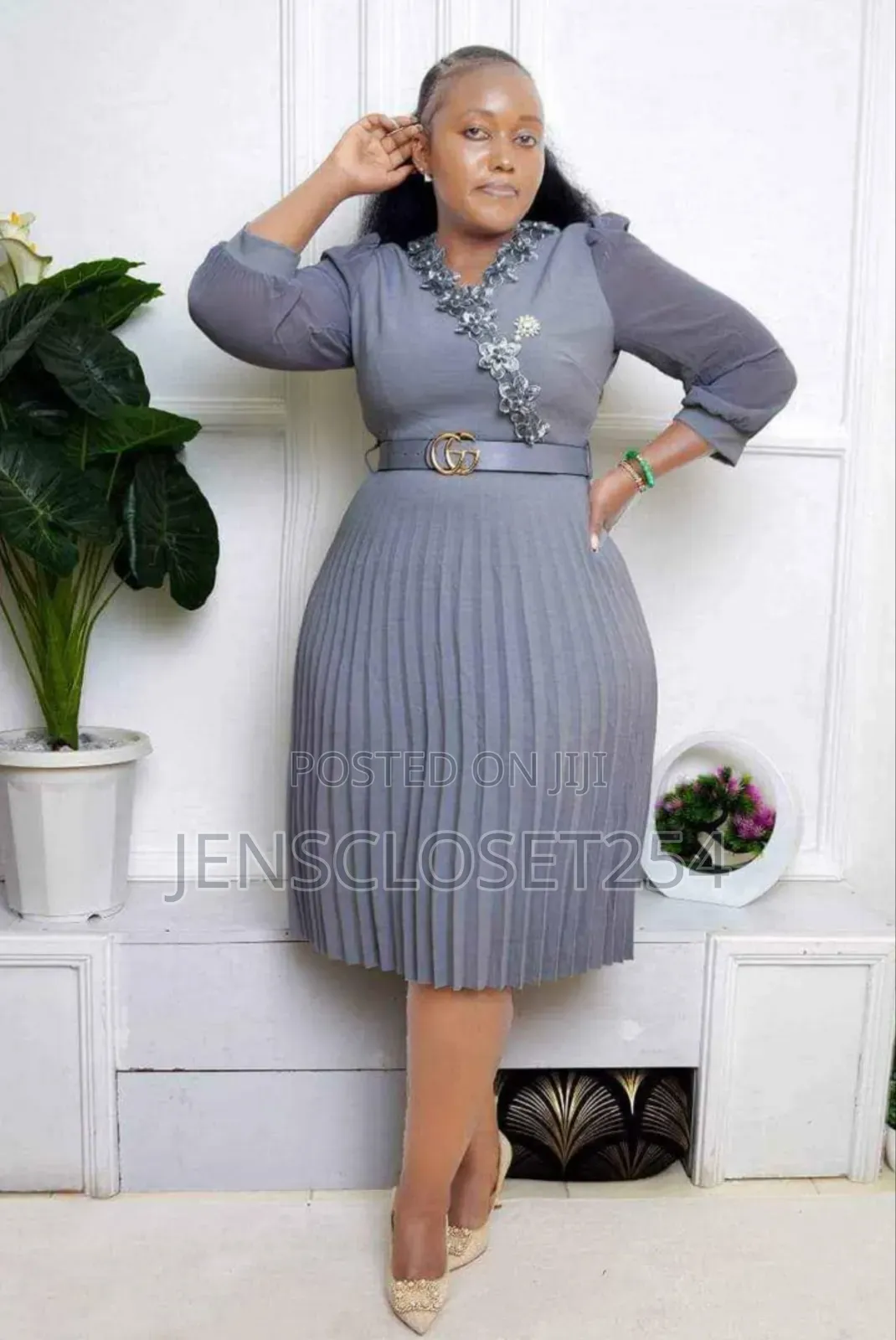 Pleated Official Dress With a Belt and a Broach