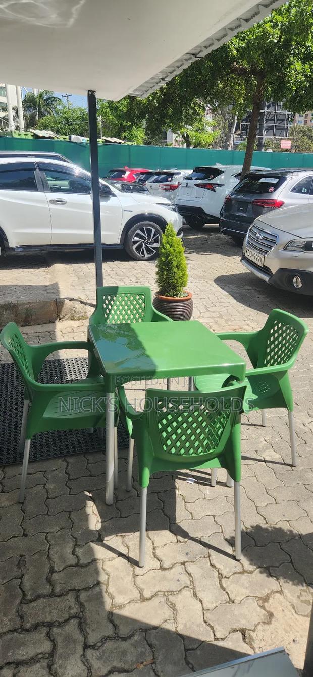 1 Plastic Table With 4 Plastic Chairs With Metal Tubing Legs Set
