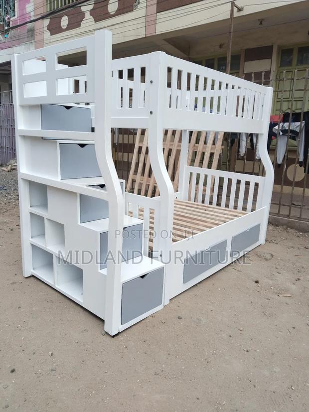 Double Decker Bunk Bed With Storage Shelves.