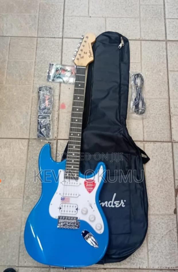 Electric Fender Solo Guitar, Bag, Strap Capo - main view