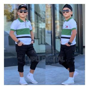 Set Comes As: Trouser, Polo Tshirt, Kofia.Available for Age: 3-12 Yrs