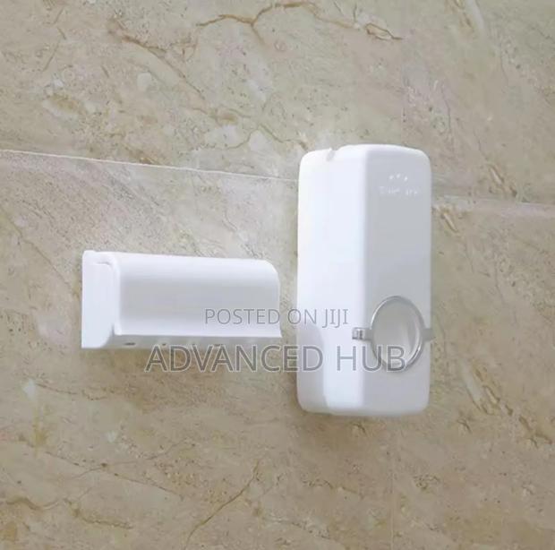 Wall Mounted Toothpaste Dispenser With Toothbrush Holder - thumbnail 3